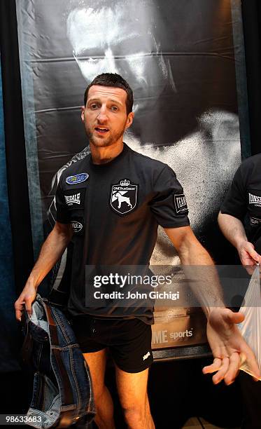 Carl Froch of England stands in front of a Mikkel Kessler poster during the weigh-in at MCH Arena on April 23, 2010 in Herning, Denmark.