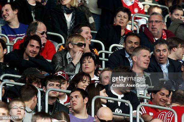 Head coach Jos Luhukay and players of FC Augsburg watch the Second Bundesliga match between 1. FC Kaiserslautern and Hansa Rostock at the...