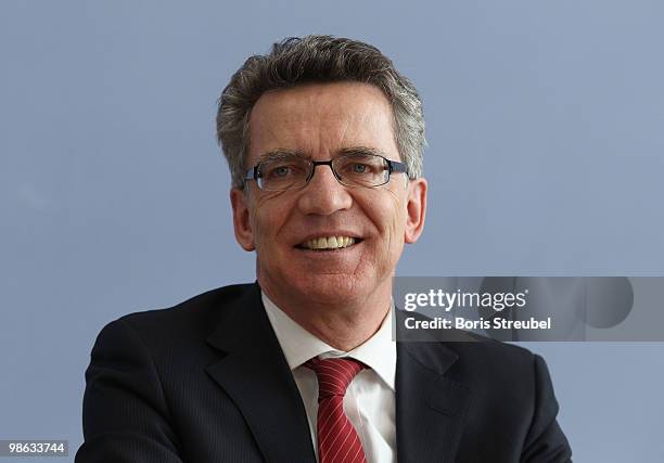 Thomas de Maiziere, German Interior Minister attend the press conference after the round table discussion on the subject of 'Gewalt im Zusammenhang...