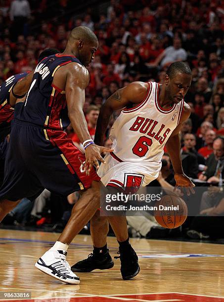 Ronald Murray of the Chicago Bulls moves to a loose ball under pressure from Antawn Jamison of the Cleveland Cavaliers in Game Three of the Eastern...