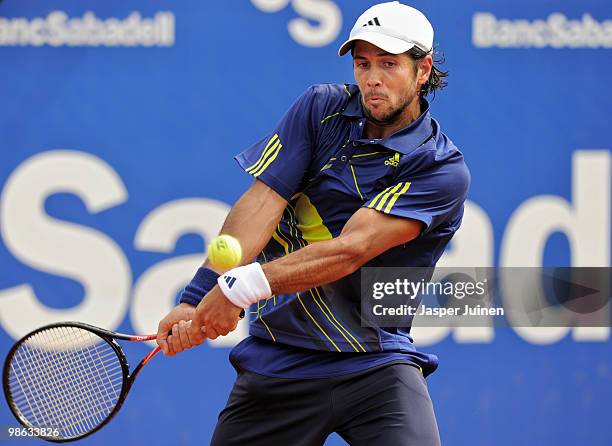 Fernando Verdasco of Spain plays a double handed backhand to Ernests Gulbis of Latvia during the quarter final match on day five of the ATP 500 World...
