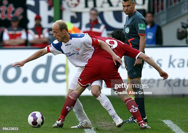 Andreas Dahlen of Rostock is challenged by Srdjan Lakic of Kaiserslautern during the Second Bundesliga match between 1. FC Kaiserslautern and Hansa...