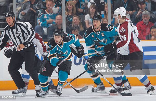 Scott Nichol and Rob Blake of the San Jose Sharks skate against Paul Stastny of the Colorado Avalanche in Game Two of the Western Conference...