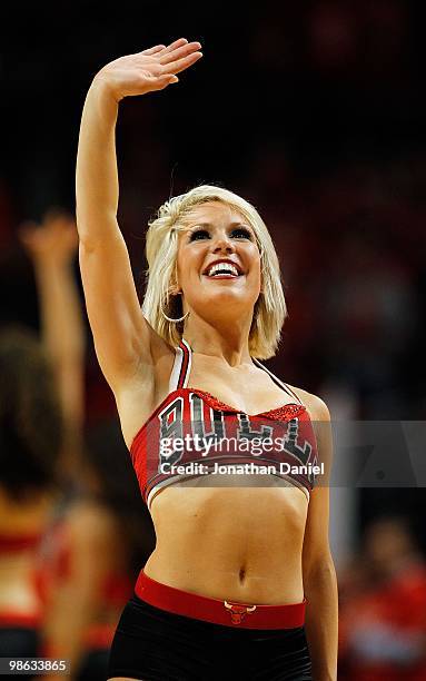 Member of the Chicago Bulls dance team "The Luvabulls" waves to crowd during a time-out between the Bulls and the Cleveland Cavaliers in Game Three...
