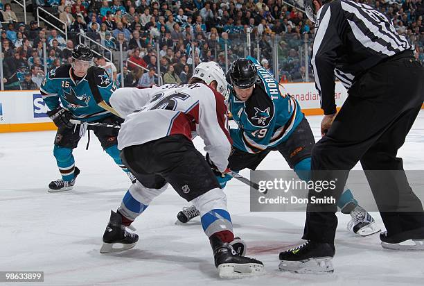 Paul Stastny of the Colorado Avalanche takes the faceoff against Joe Thornton and Dany Heatley of the San Jose Sharks in Game Two of the Western...