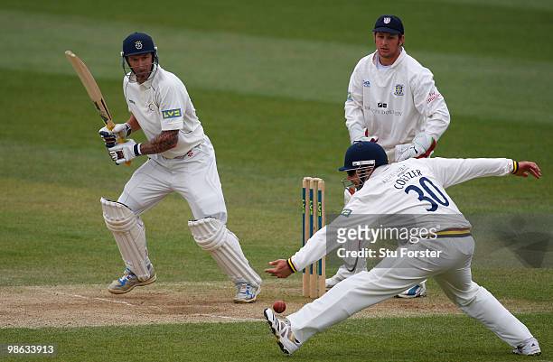 Hampshire batsman Nic Pothas pushes the ball past fielder Kyle Coetzer to pick up some runs as Phil Mustard looks on during day three of the LV...