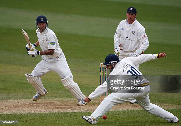 Hampshire batsman Nic Pothas pushes the ball past fielder Kyle Coetzer to pick up some runs as Phil Mustard looks on during day three of the LV...