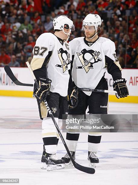 Sidney Crosby and Kris Letang of the Pittsburgh Penguins talk during a break in action against the Ottawa Senators in Game 4 of the Eastern...