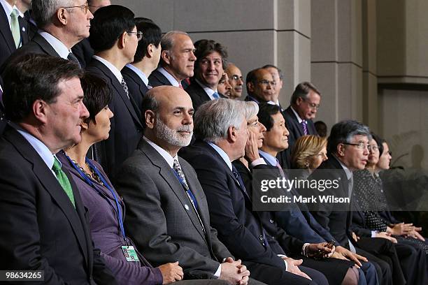 Chairman of the Federal Reserve Ben Bernanke participates in a group photo with finance ministers at the International Monetary Fund on April 23,...