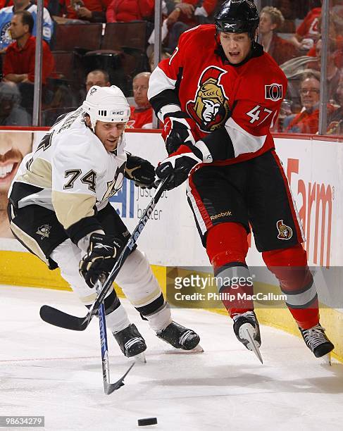 Jay McKee of the Pittsburgh Penguins battles for the puck with Zack Smith of the Ottawa Senators in Game 4 of the Eastern Conference Quaterfinals...
