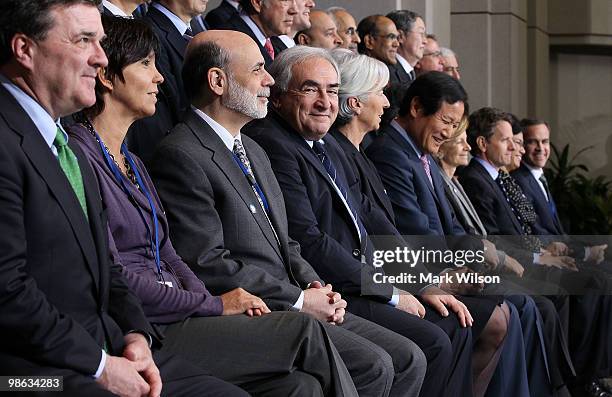 Chairman of the Federal Reserve Ben Bernanke participates in a group photo with finance ministers at the International Monetary Fund on April 23,...