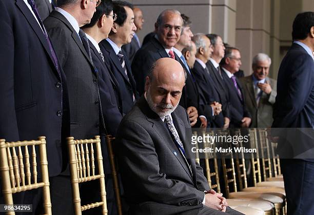 Chairman of the Federal Reserve Ben Bernanke participates in a group photo at the International Monetary Fund on April 23, 2010 in Washington, DC....