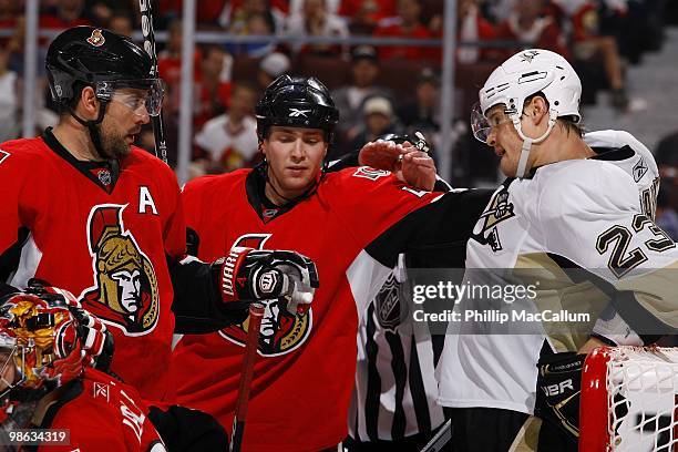 Chris Phillips and Zack Smith of the Ottawa Senators get in to a scuffle with Alexei Ponikarovsky of the Pittsburgh Penguins in Game 4 of the Eastern...