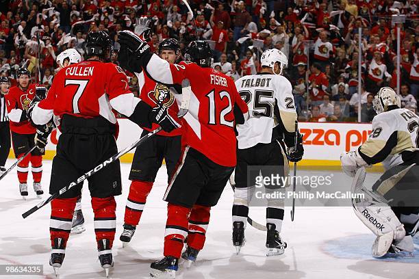 Matt Cullen, Jason Spezza and Mike Fisher of the Ottawa Senators celebrate a goal against the Pittsburgh Penguins in Game 4 of the Eastern Conference...