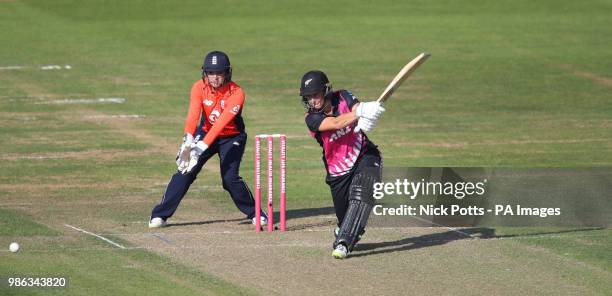 New Zealand batter Sophie Devine drives watched by England wicketkeeper Sarah Taylor during the T20 Tri Series match at the Brightside Ground,...