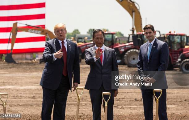 President Donald Trump speaks as Foxconn CEO Terry Gou and U.S. House Speaker Paul Ryan watch at the groundbreaking for the Foxconn Technology Group...