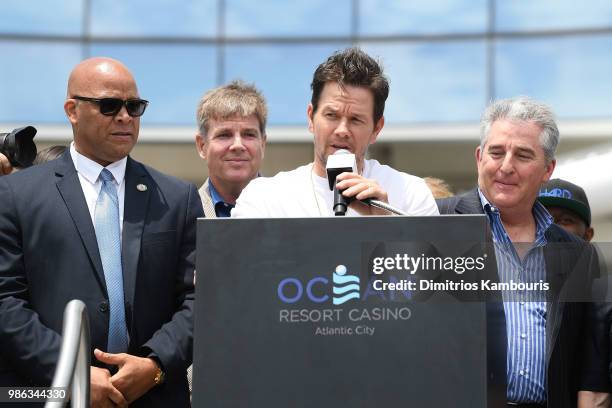 Mark Wahlberg speaks onstage at the Ocean Resort Casino opening weekend ribbon cutting ceremony with Atlantic City Mayor Frank Gilliam, Scott Brown...