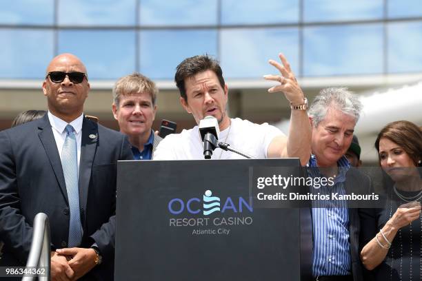 Mark Wahlberg speaks onstage at the Ocean Resort Casino opening weekend ribbon cutting ceremony with Atlantic City Mayor Frank Gilliam, Scott Brown...