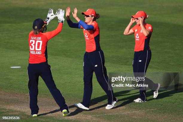 Nat Scriver of England celebrates with Sarah Taylor after she catches Sophie Devine of New Zealand during England Women vs New Zealand Women...