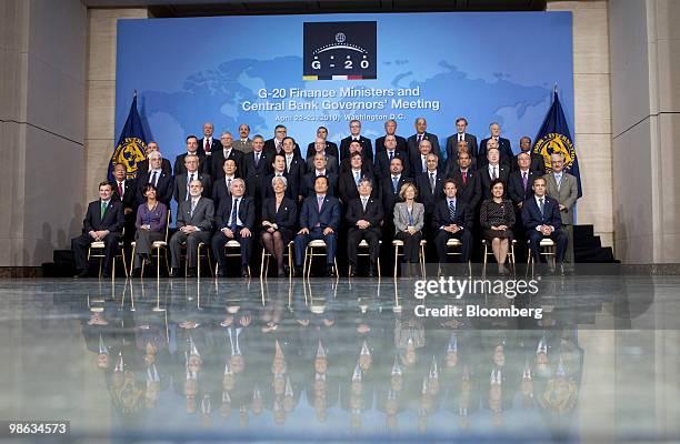 Finance ministers and central bank governors including James Flaherty, Canada's finance minister, front row left to right, Mercedes Marco del Pont,...
