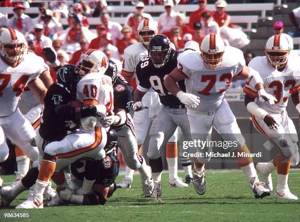 After Running Back Gary Anderson of the Tampa Bay Buccaneers catches a pass from Quarter Back Vinny Testaverde, Anderson gets tackled by Atlanta...