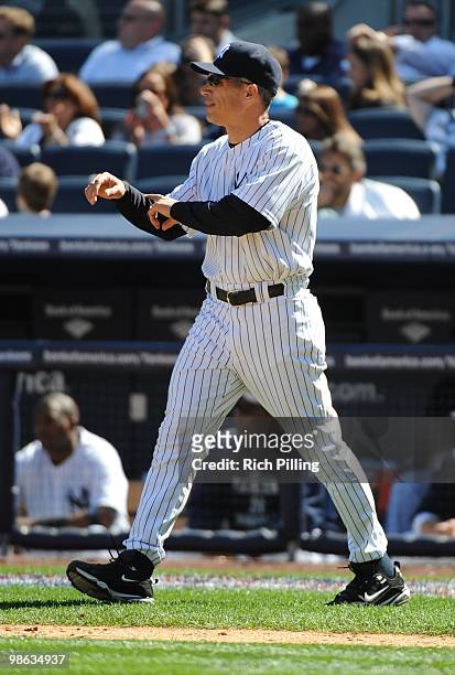 Joe Girardi, manager of the New York Yankees makes a pitching change during the game against the Los Angeles Angels of Anaheim at Yankee Stadium in...