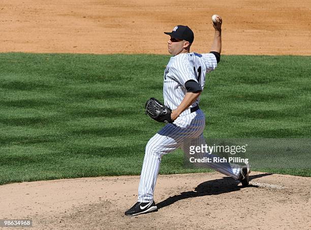 Alfredo Aceves of the New York Yankees pitches during the game against the Los Angeles Angels of Anaheim at Yankee Stadium in the Bronx, New York on...