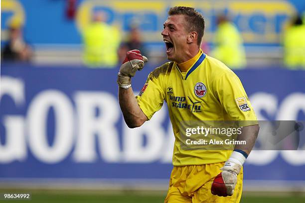 Goalkeeper Alexander Walke of Rostock celebrates after the Second Bundesliga match between 1. FC Kaiserslautern and Hansa Rostock at the Fritz-Walter...