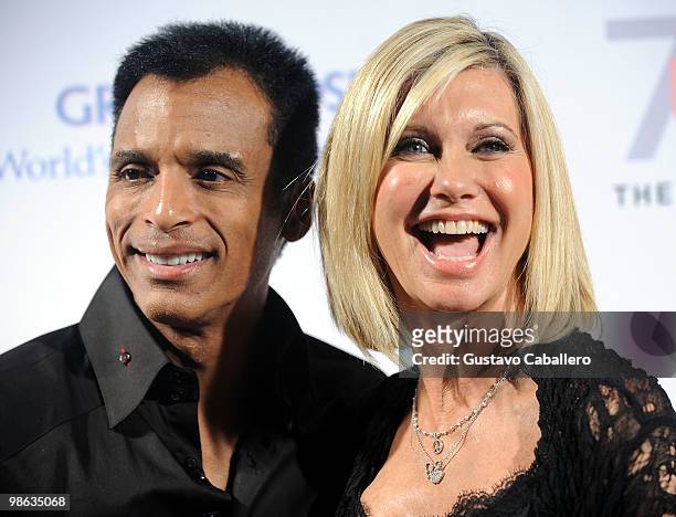 Singer Jon Secada and Olivia Newton-John attends the "Pink and Blue for Two" event at Raleigh Hotel on April 22, 2010 in Miami Beach, Florida.