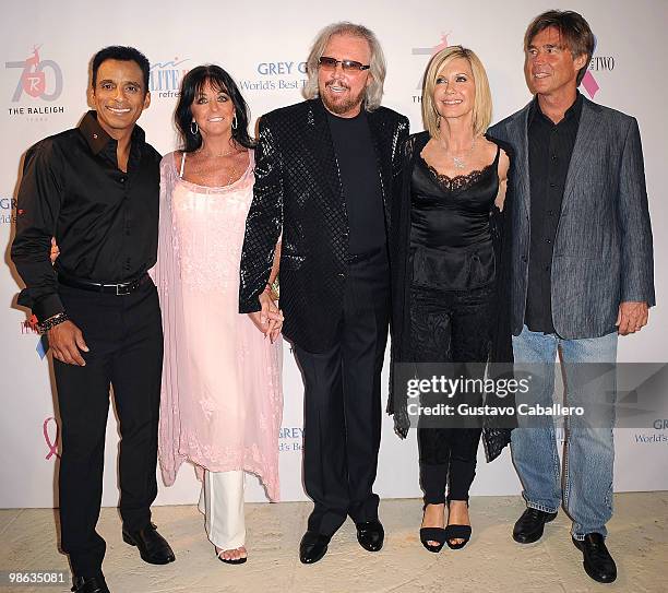 Singer Jon Secada,Linda Gibb,Barry Gibb,Olivia Newton-John and husband John Easterling attends the "Pink and Blue for Two" event at Raleigh Hotel on...