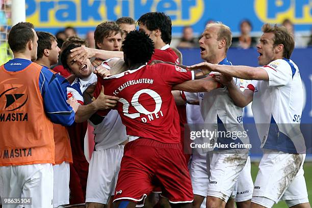 Players of Kaiserslautern and Rostock fight during the Second Bundesliga match between 1. FC Kaiserslautern and Hansa Rostock at the Fritz-Walter...