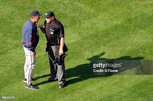 Manager Jim Riggleman of the Washington Nationals argues with home plate umpire Paul Schrieber after being ejected from the game against the...
