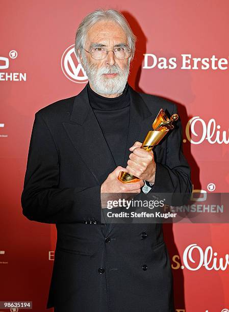 Michael Haneke holds up his Lola for best script at the 60th German Film Prize awards ceremony on April 23, 2010 in Berlin, Germany.