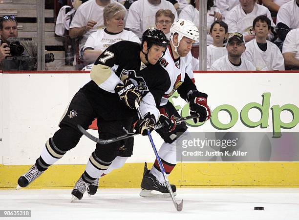 Mark Eaton of the Pittsburgh Penguins and Matt Carkner of the Ottawa Senators battle for a puck in Game Five of the Eastern Conference Quarterfinals...