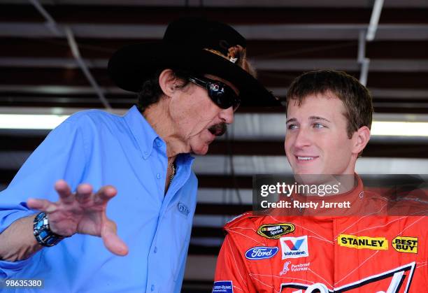 Team owner Richard Petty talks with Kasey Kahne , driver of the Budweiser Ford, in the garage during practice for the NASCAR Sprint Cup Series...