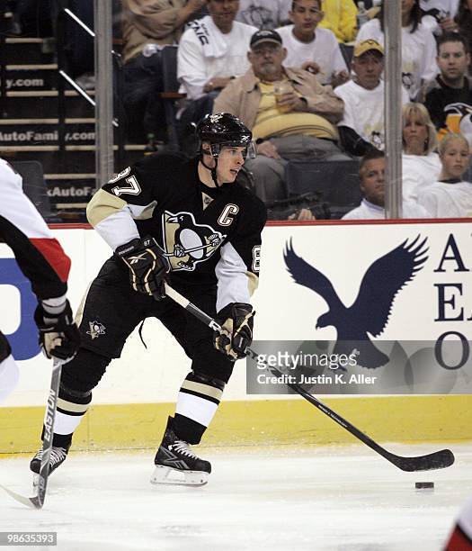 Sidney Crosby of the Pittsburgh Penguins looks to make a pass against the Ottawa Senators in Game Five of the Eastern Conference Quarterfinals during...