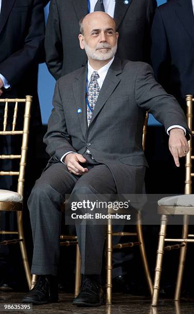 Ben S. Bernanke, chairman of the U.S. Federal Reserve, gestures to Dominique Strauss-Kahn, managing director of the International Monetary Fund , to...