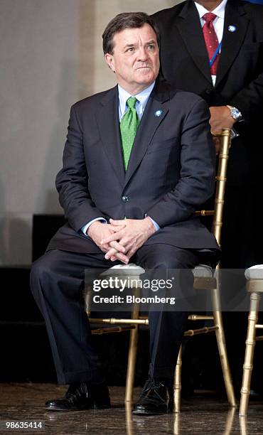 James Flaherty, Canada's finance minister, sits during a group photo of the Group of 20 Finance Ministers and Central Bank Governors' meeting in...