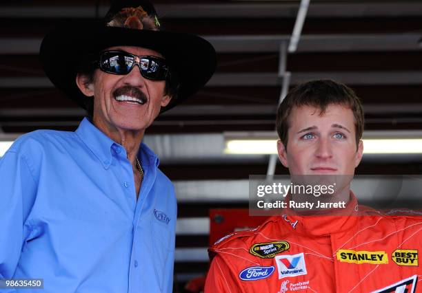 Team owner Richard Petty stands with Kasey Kahne , driver of the Budweiser Ford, in the garage during practice for the NASCAR Sprint Cup Series...