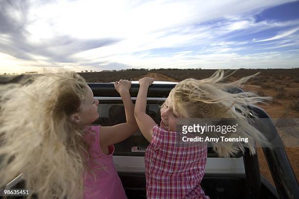 Natalie and Samantha Turner drive out to their farm paddocks in the back of their dad's pick-up truck to clean out watering troughs and check on...