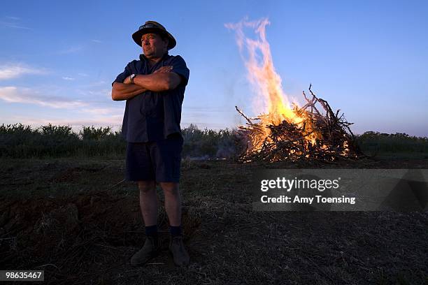 Fruit grower, Frank Eddy burns over 200 peach trees in response to the low water allocations during the drought in the Murray-Darling Basin October...
