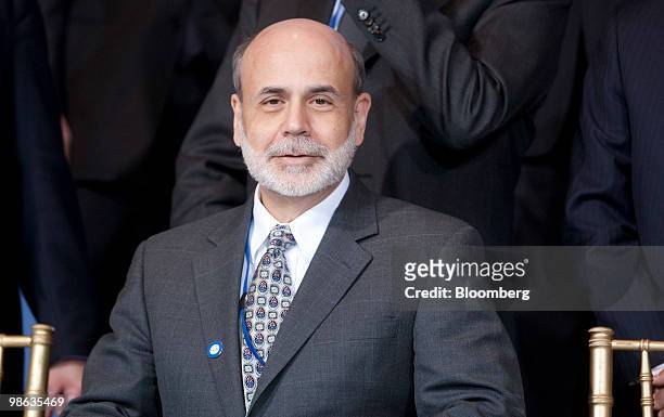 Ben S. Bernanke, chairman of the U.S. Federal Reserve, sits during a group photo at the Group of 20 Finance Ministers and Central Bank Governors'...