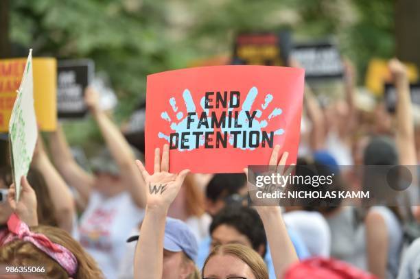 People demonstrate in Washington, DC, on June 28 demanding an end to the separation of migrant children from their parents. - US President Donald...