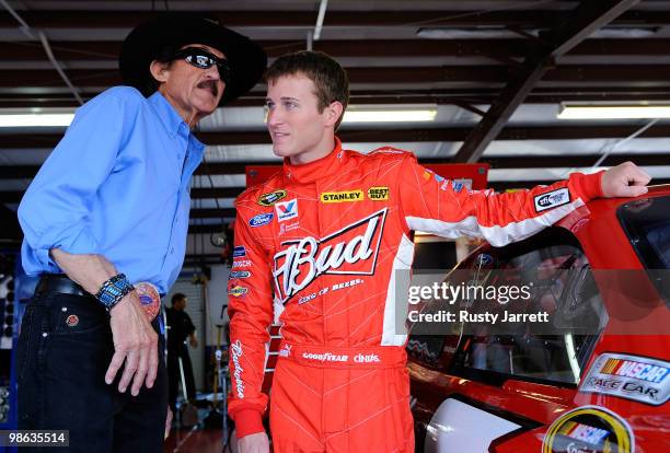 Team owner Richard Petty talks with Kasey Kahne , driver of the Budweiser Ford, in the garage during practice for the NASCAR Sprint Cup Series...