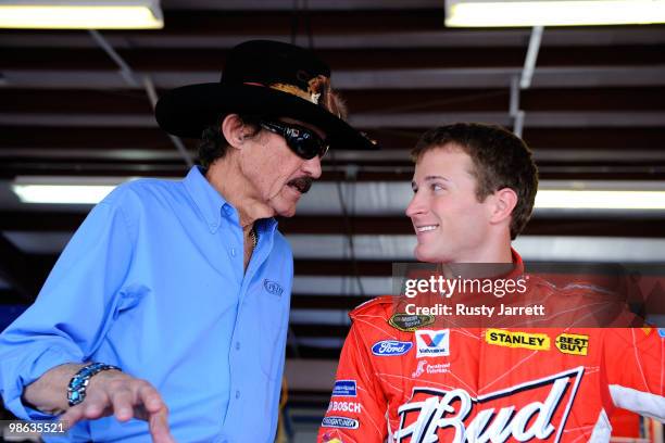 Team owner Richard Petty talks with Kasey Kahne , driver of the Budweiser Ford, in the garage during practice for the NASCAR Sprint Cup Series...