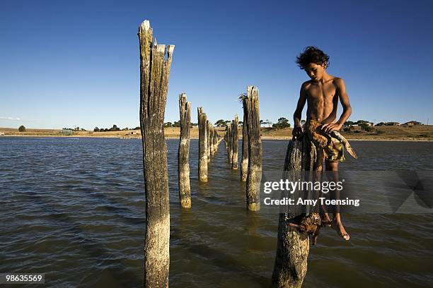 Kids from the Raukkan, Njarainjari Aboriginal Community make their way to deeper water in a quickly receding Lake Albert March 4, 2008 in Meningie,...
