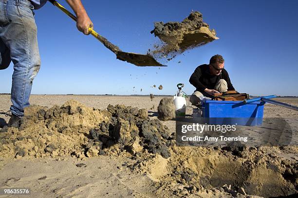 Scientists, Paul Shand and Richard Merry take soil samples on the dried up lake bed of Lake Albert March 5, 2008 in South Australia, Australia. The...