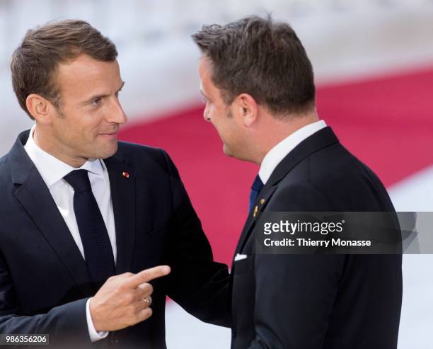 French President Emmanuel Macron is talking with the Luxembourg Prime Minister Xavier Bettel as they arrive for an EU Summit at European Council on...
