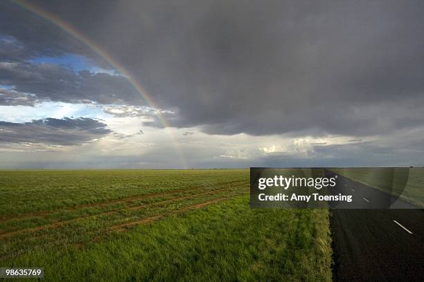 Rainbow bends over a field after a thunderstorm February 5, 2008 near Hay, New South Wales, Australia.