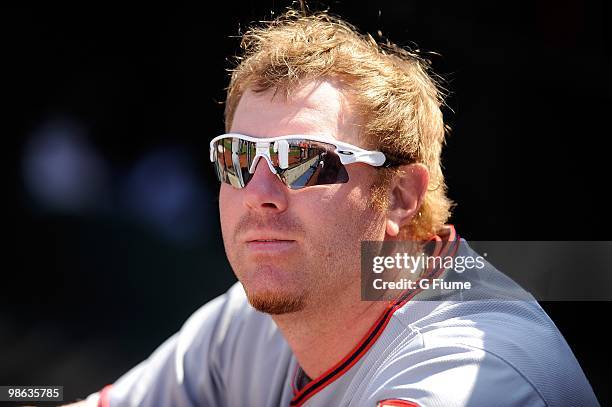 Adam Dunn of the Washington Nationals watches batting practice before the game against the Philadelphia Phillies on Opening Day at Citizens Bank Park...